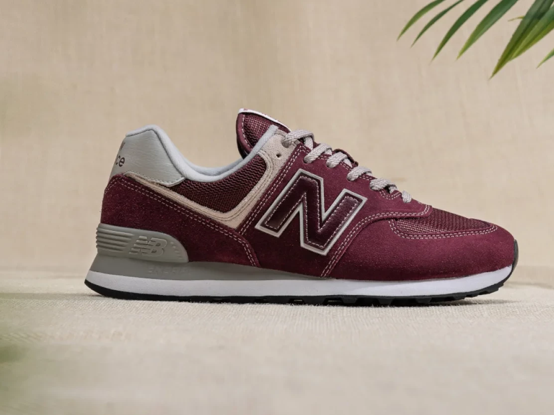 Wide Fit Shoes Shopify Bespoke Store Design image of a New Balance trainer on a background